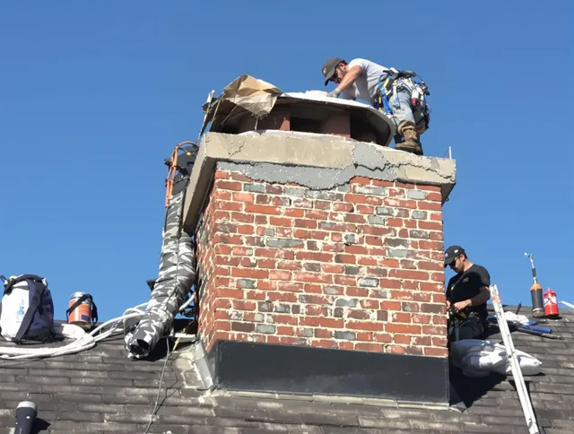 West Palm Beach Chimney Sweep installing a custom chimney crown in West Palm Beach, FL
