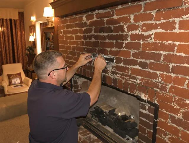 West Palm Beach Chimney Sweep expert fixing a fireplace in West Palm Beach, FL